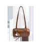 Cognac brown cylinder shoulder bag with two long straps and a baseball charm, option Brown