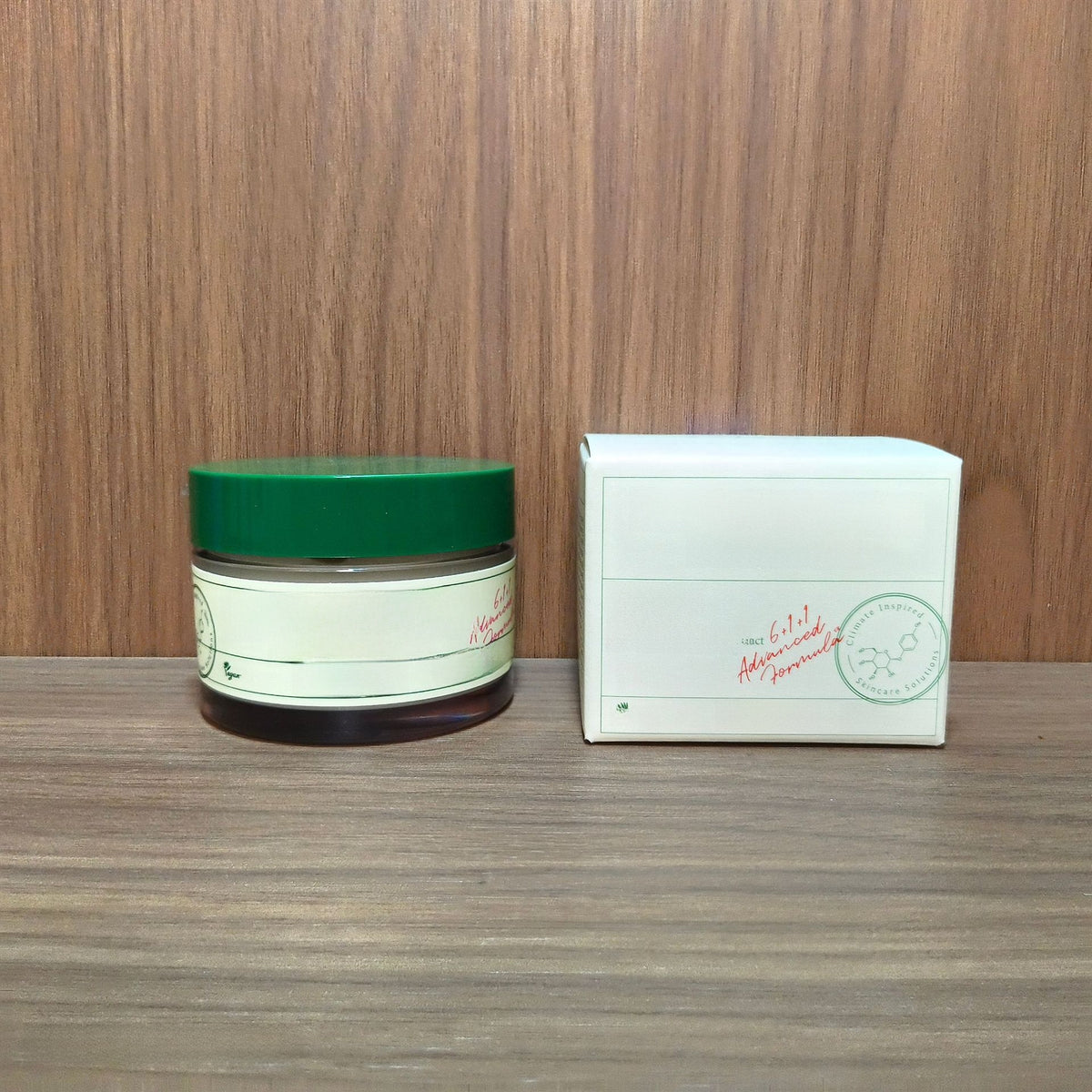AXIS-Y Dark Spot Correcting Glow Cream 50 ml jar with a green lid next to its carton