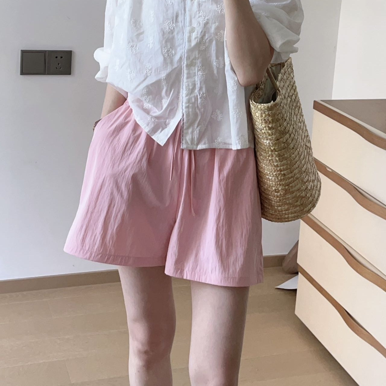 Wide leg ice silk shorts styled for a casual day with a soft drape across the thigh