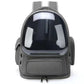 Gray dome pet carrier backpack with a front zip pocket and side vent holes on a white background, front view