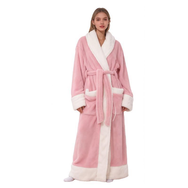 Woman wearing a long pink flannel bathrobe with white shawl collar, cuffs and pockets, pink variant