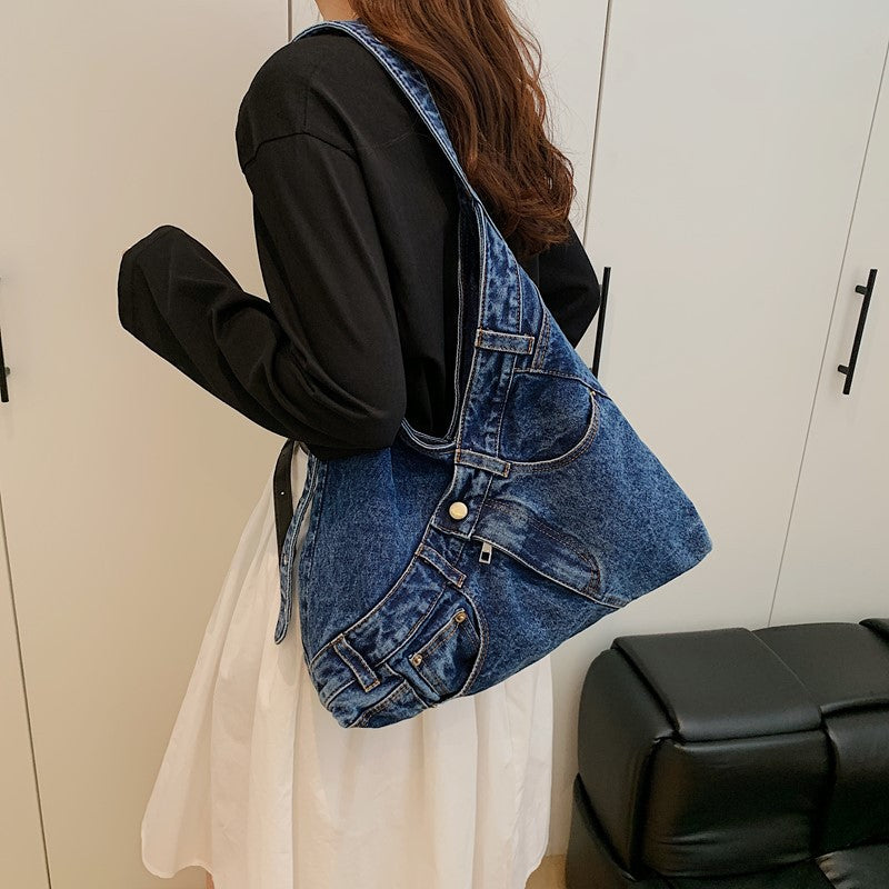 Slouchy denim and canvas shoulder bag styled from jeans with pockets and rivets
