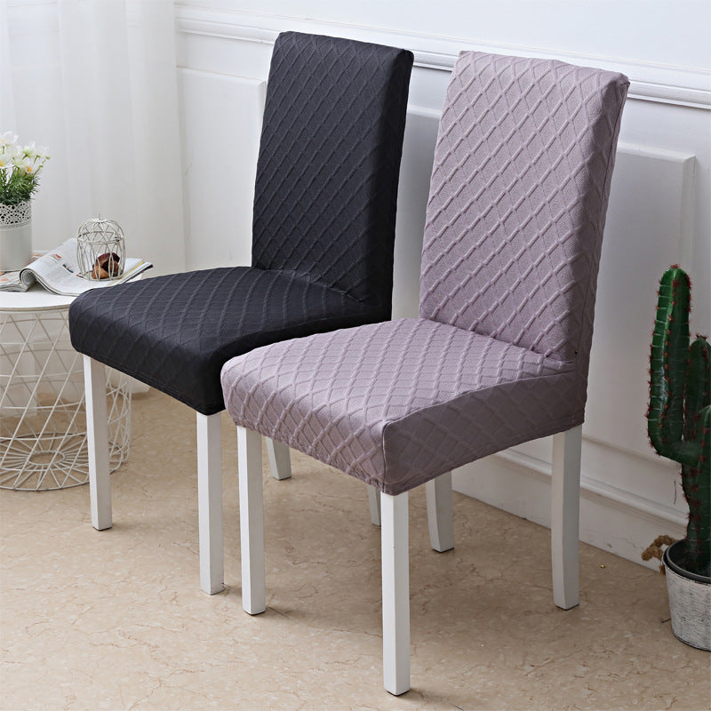 Black and light grey diamond jacquard chair covers on two dining chairs