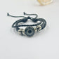 Set of braided cord bracelets showing several celestial and nature charm designs