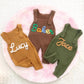 Baby wearing the knit dungarees over a long-sleeve top in an everyday indoor moment