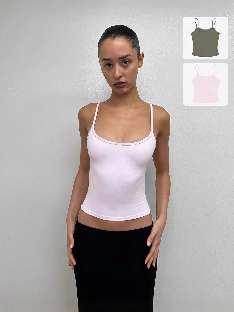 Fitted spaghetti strap camisole with a scoop neck shown on a model