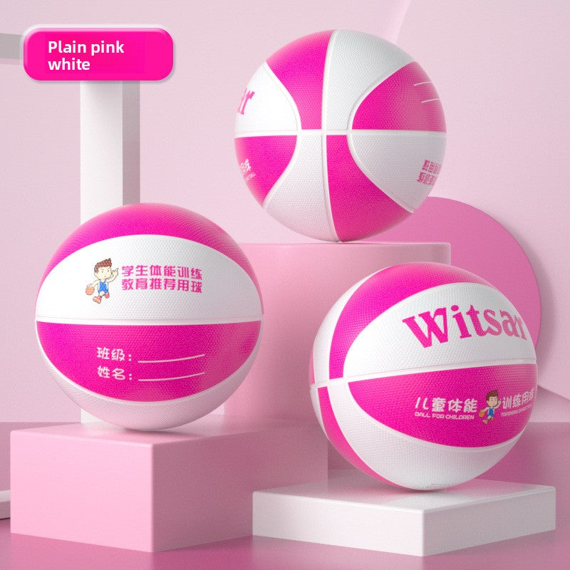 Pink and white rubber basketball for beginners on a pastel pink studio set