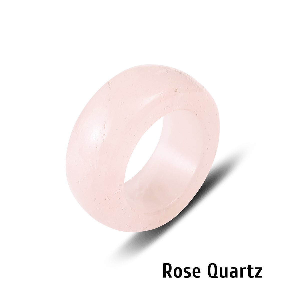 Pale rose quartz stone ring carved solid on a white background