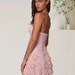 Floral embroidery strapless dress angled view showing fit across the bodice