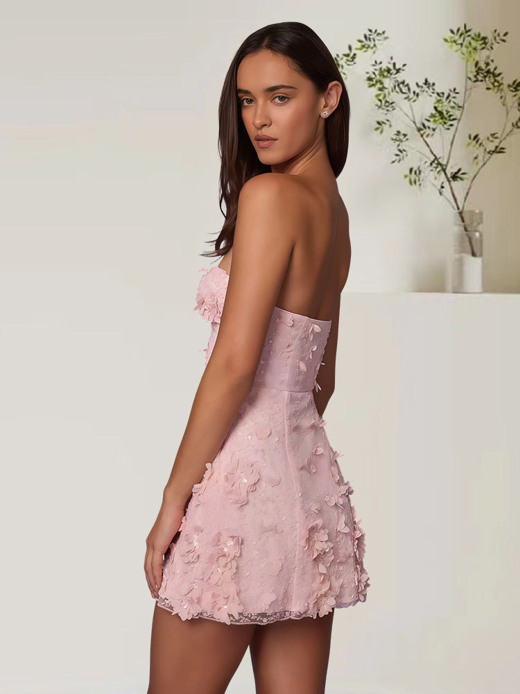 Floral embroidery strapless dress angled view showing fit across the bodice