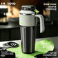 Cream and green 1000ml insulated stainless steel travel mug with side handle on a kitchen counter