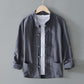 Gray frog closure shirt jacket with stand collar on a hanger over a white tee, image of the size M option