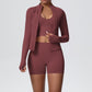 Brown seamless yoga set showing the stand collar zip jacket, cropped tank and matching shorts