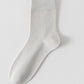 Light grey bamboo viscose blend mid calf sock laid flat on a pale background