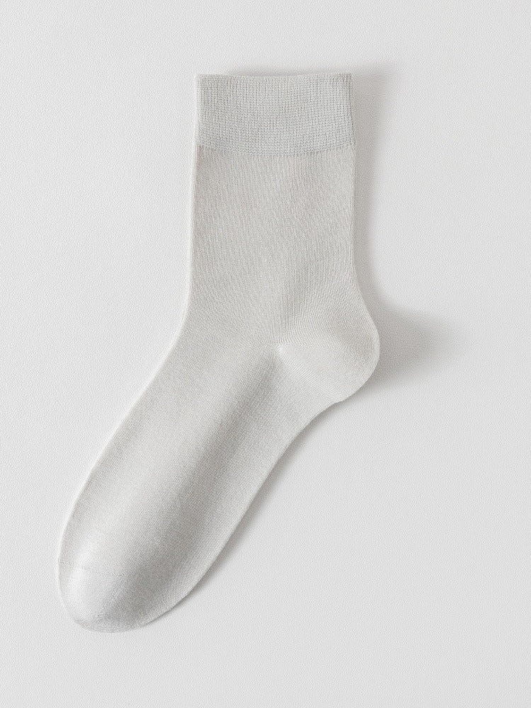 Light grey bamboo viscose blend mid calf sock laid flat on a pale background
