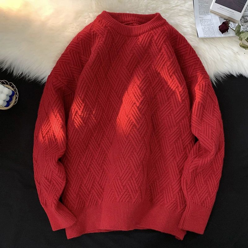 Red heavyweight round neck knit pullover with a raised basketweave jacquard texture