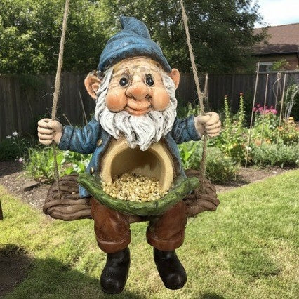 Hand holding the resin gnome bird feeder on its swing to show its light weight