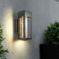 LED crystal wall sconce glowing warm and washing light up and down the wall
