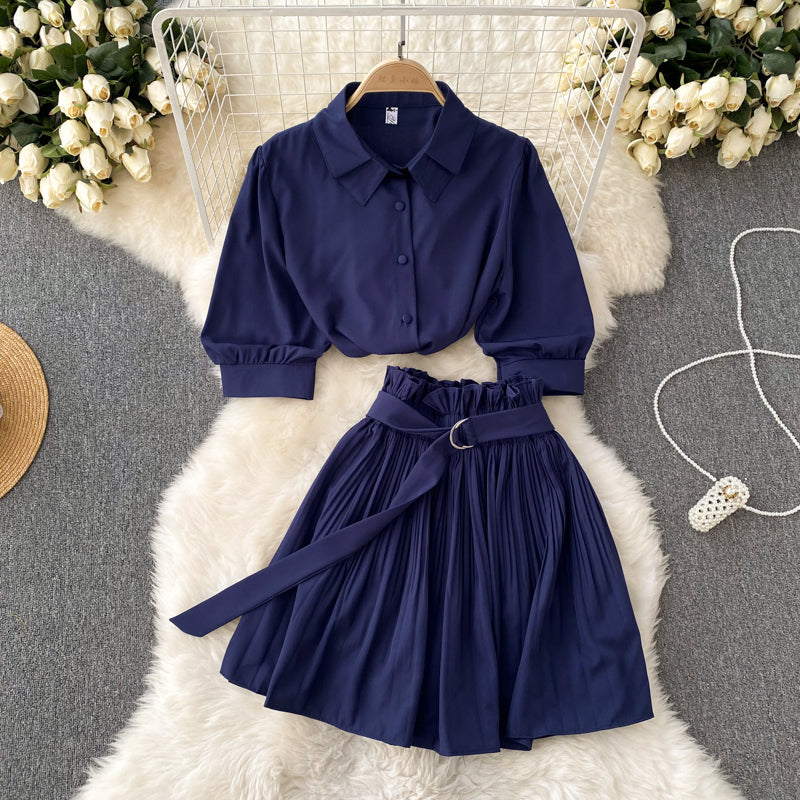 Short-sleeve shirt and skirt set on a clean studio background