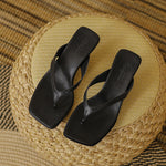 Square-toe kitten heel sandals in soft studio lighting showing the heel and toe shape