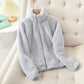 Gray plush fleece zip up jacket with a full length zip shown flat on a plain background