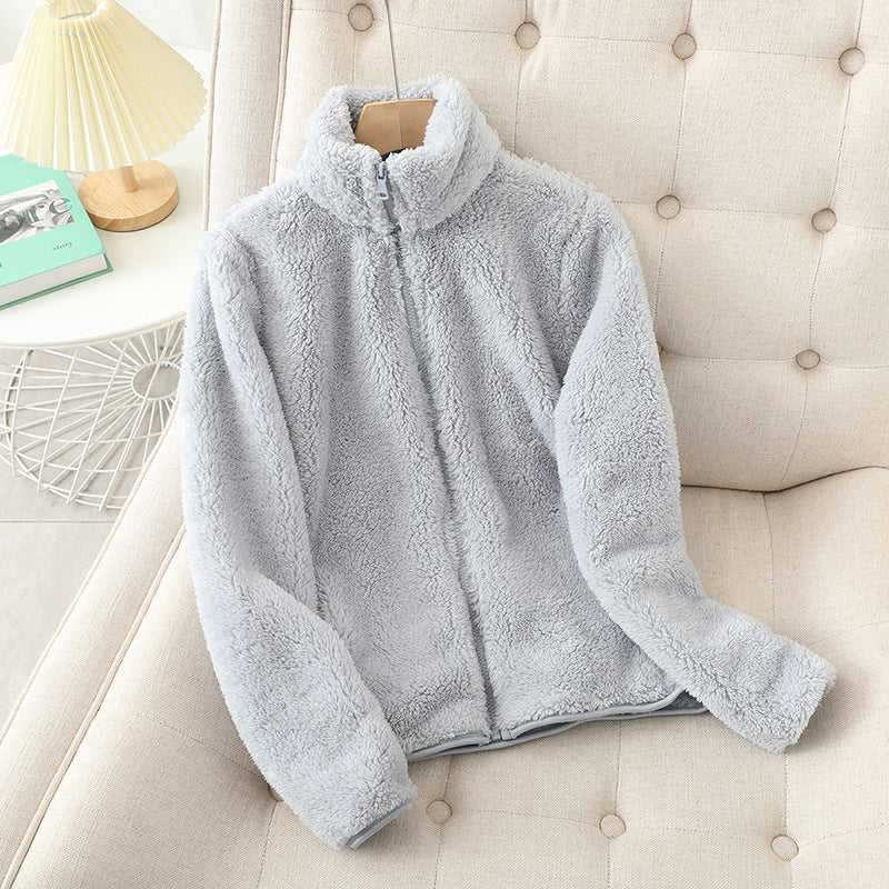 Gray plush fleece zip up jacket with a full length zip shown flat on a plain background
