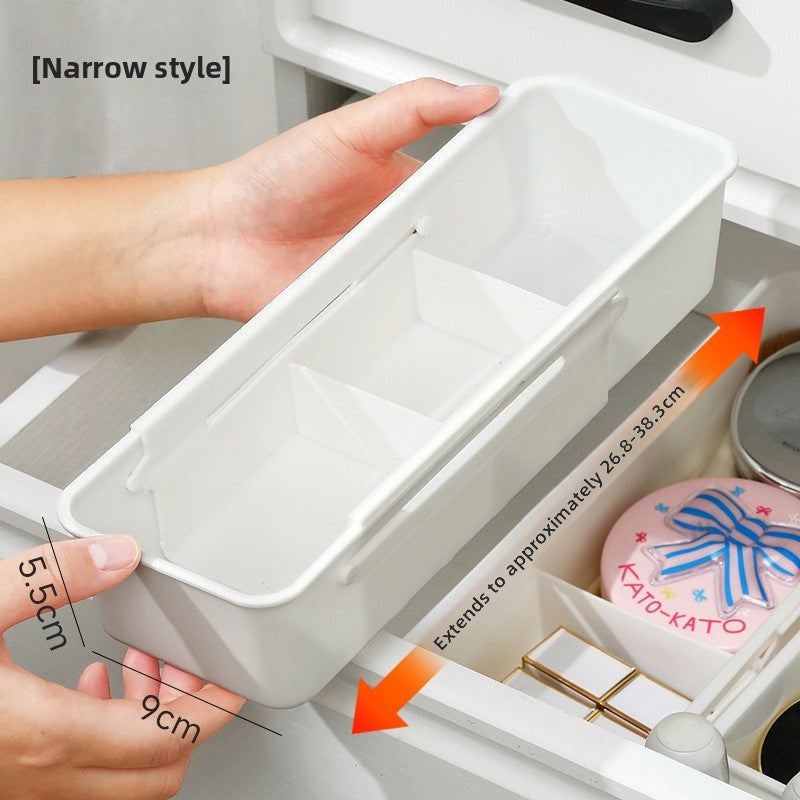 Narrow white drawer organizer box measuring 9 cm wide and 5.5 cm tall held in two hands
