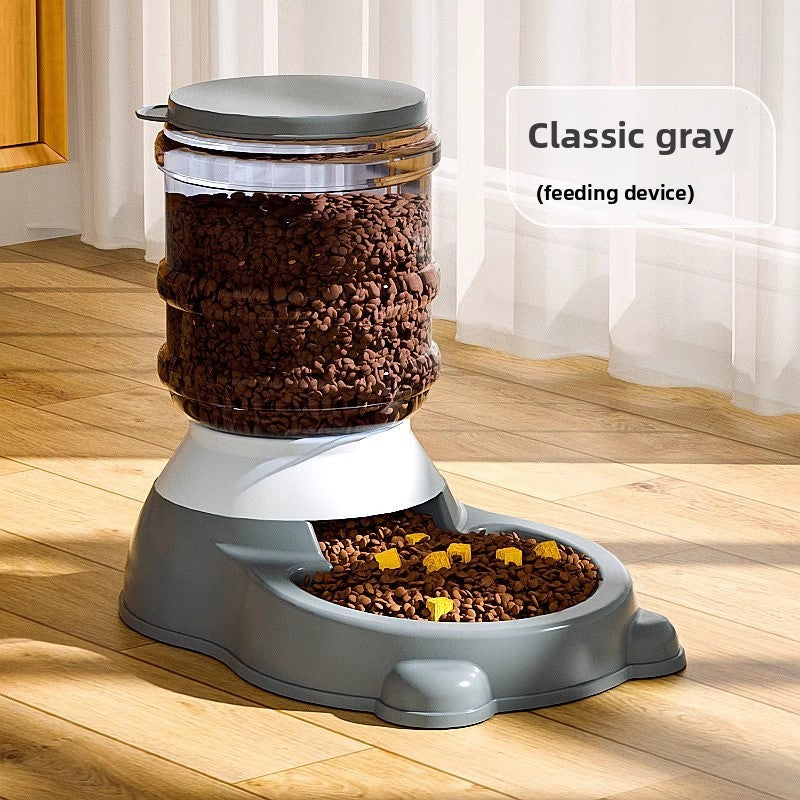 Gravity pet water dispenser and food feeder in gray on a kitchen floor