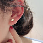 Mini heart gold stud earring in plated alloy with zircon accent, front hero view
