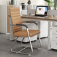 Low back tan khaki leather cantilever conference chair, foam seat, fixed armrests and chrome frame in an office