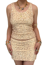 Yellow allover sequin tank and matching mini skirt set worn as a full outfit