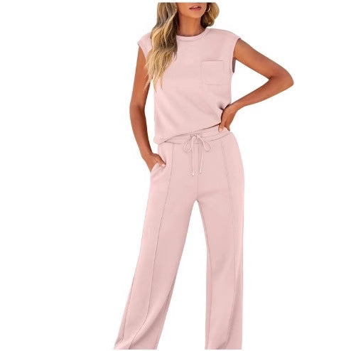 Close-up of the soft fluid fabric and drape of the wide-leg trousers