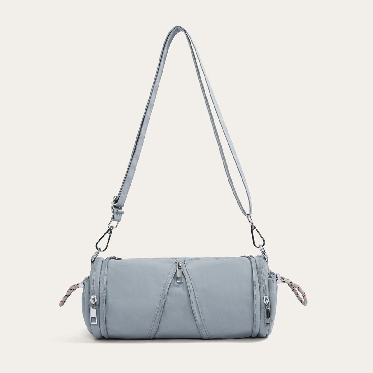 Blue cylindrical nylon crossbody bag with stitched front lines and silver hooks, variant image for the blue color