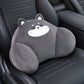 Gray dog lumbar support pillow with a white muzzle resting on a black car seat