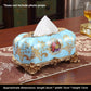 European style resin display piece with pearl shell inlay and gilt scrollwork on a tabletop scene