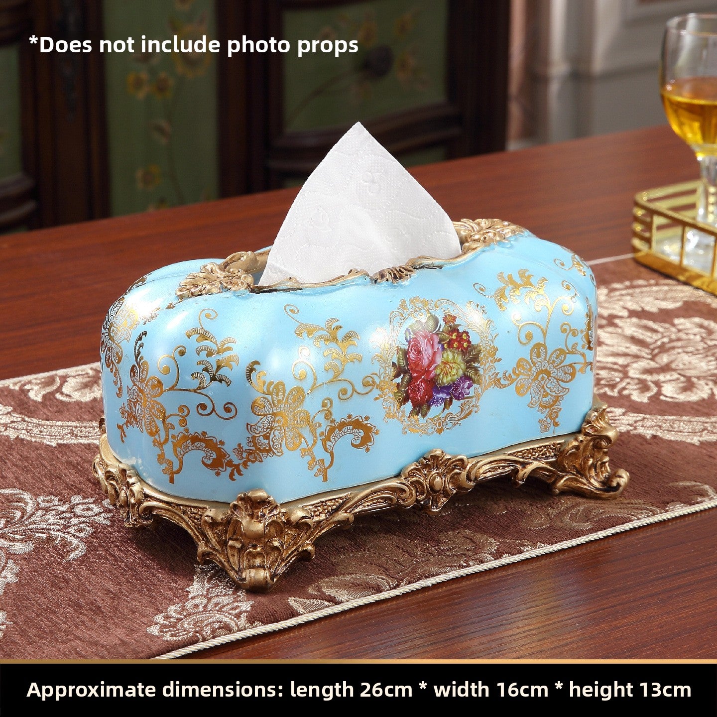 European style resin display piece with pearl shell inlay and gilt scrollwork on a tabletop scene