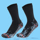 Gallery photo of black crew socks with a gray heel and red accents splashed by water, not a listed color option