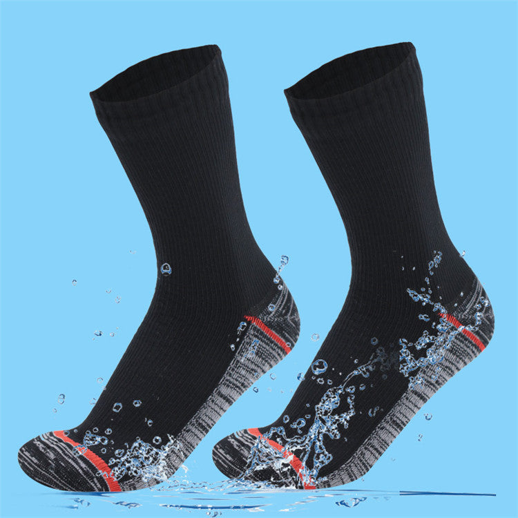 Gallery photo of black crew socks with a gray heel and red accents splashed by water, not a listed color option