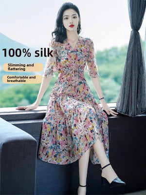 Printed floral silk midi dress front view with frilled V-neck and tiered skirt