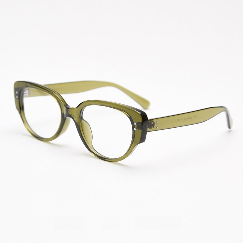 Olive green translucent oval cat eye frame with clear lenses at an angle
