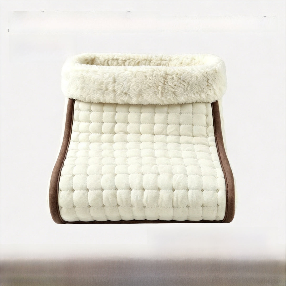 Off white quilted electric foot warmer with a cream plush cuff and brown trim, UK plug option