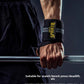 Black elastic wrist wrap worn on a wrist gripping a loaded barbell in a gym