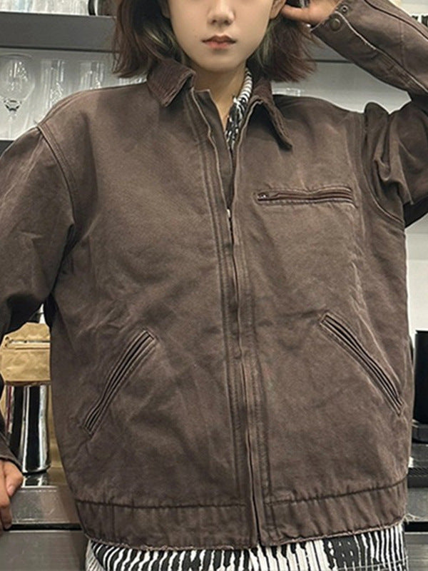 Brown washed cotton workwear jacket worn open with corduroy collar and zip chest pocket