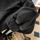 Hood and shoulder detail of the faded black pullover with the chest eye print