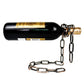 Antique bronze iron chain holding a wine bottle level above a coiled chain base on a white background