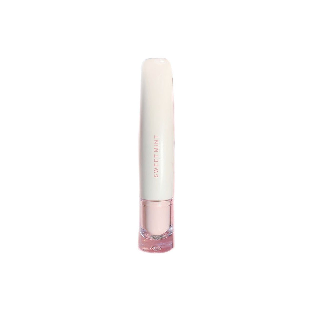 Single cream lip glaze tube standing upright with a clear applicator base on a white background