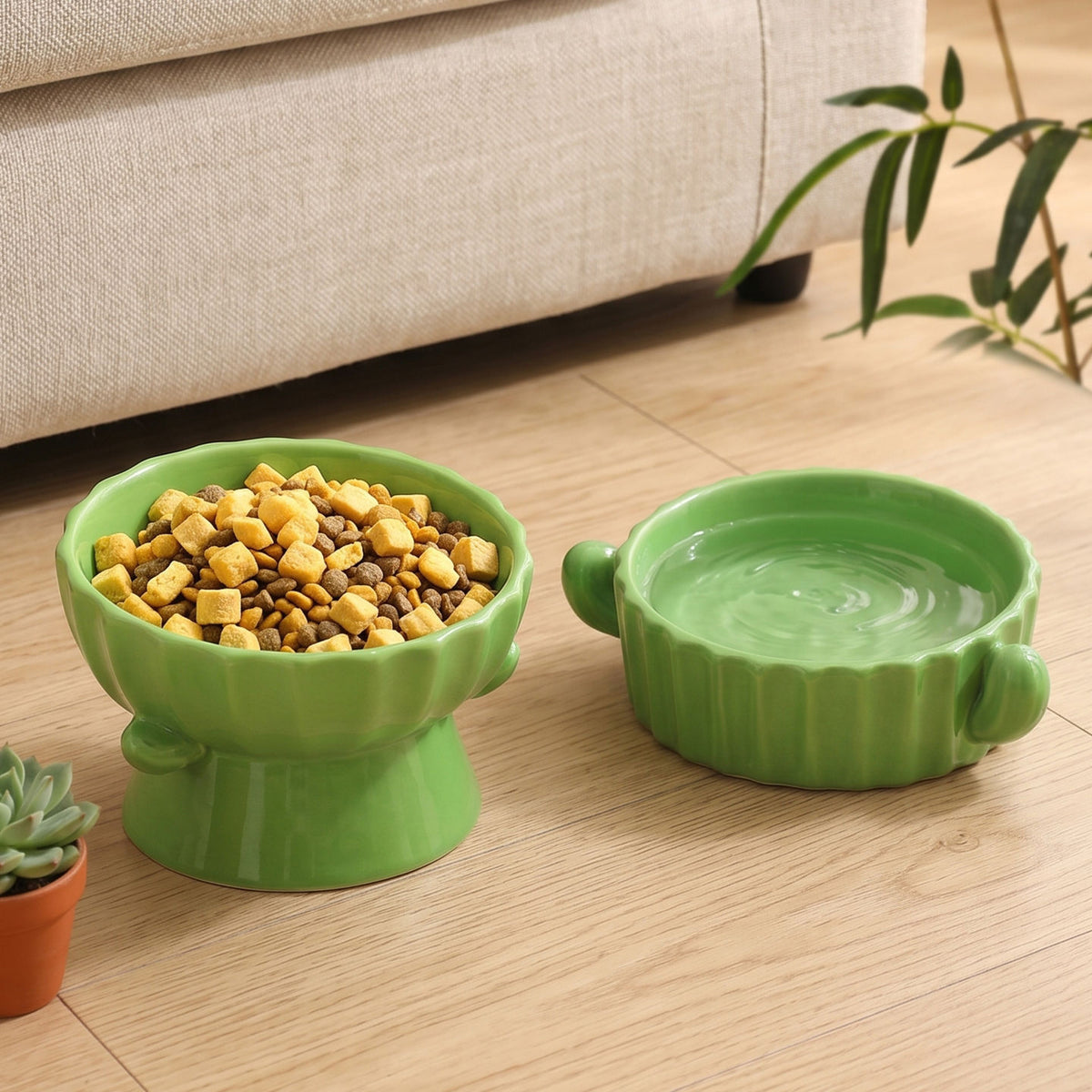 Green scalloped ceramic raised bowl full of kibble beside a low water bowl, styled scene not among the listed designs