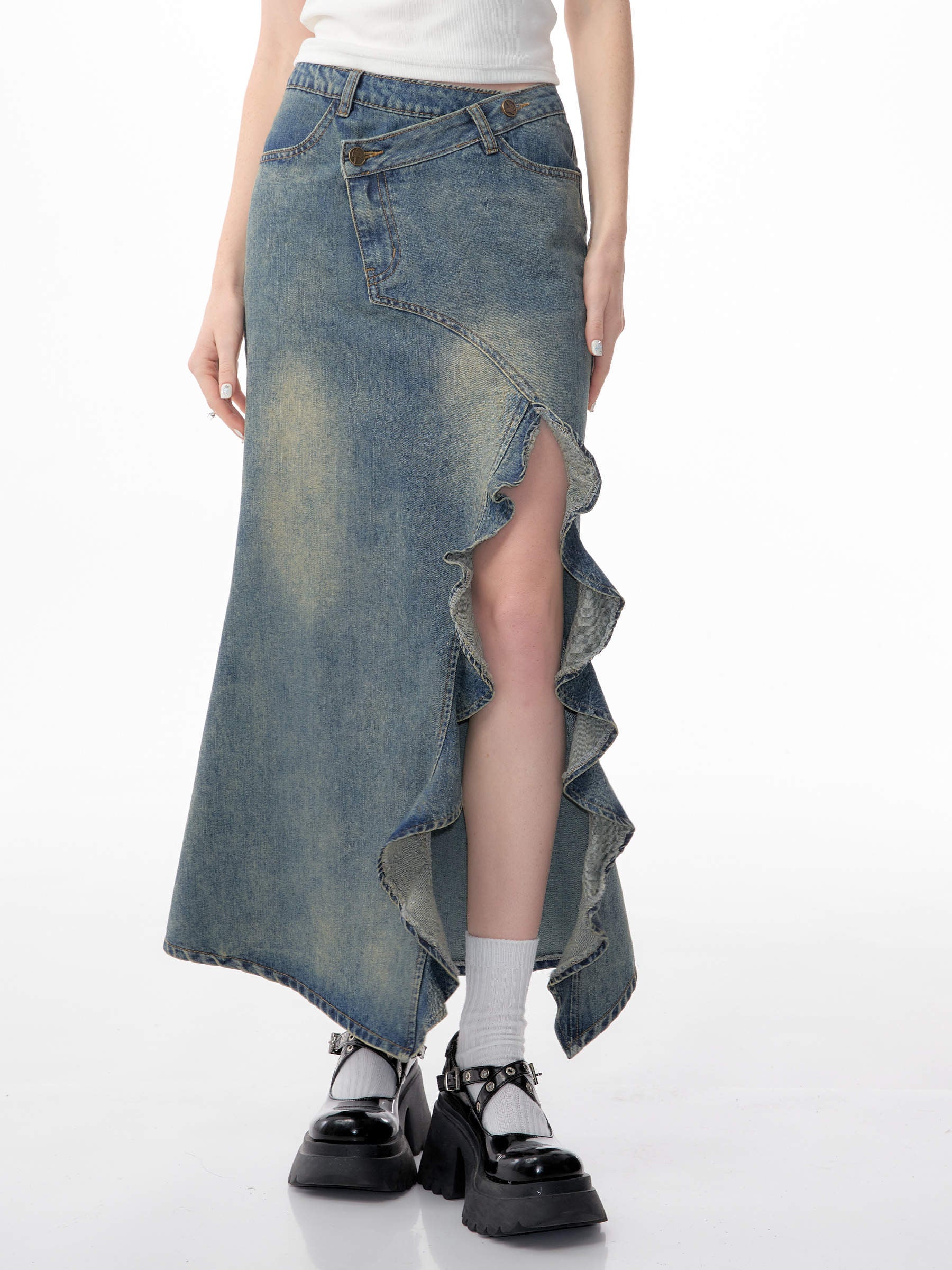 Worn on the street with a white blouse tucked in and a coffee in hand