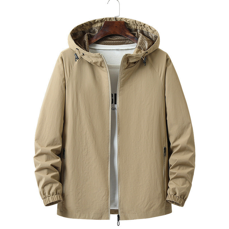 Khaki nylon hooded windbreaker laid flat showing elastic hem