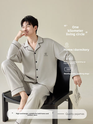 Side view of the men's button-front pajama shirt showing the long sleeve and piping